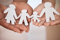 Abstract image of an adoptive family with paper cut outs