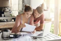 couple reviewing the federal tax brackets